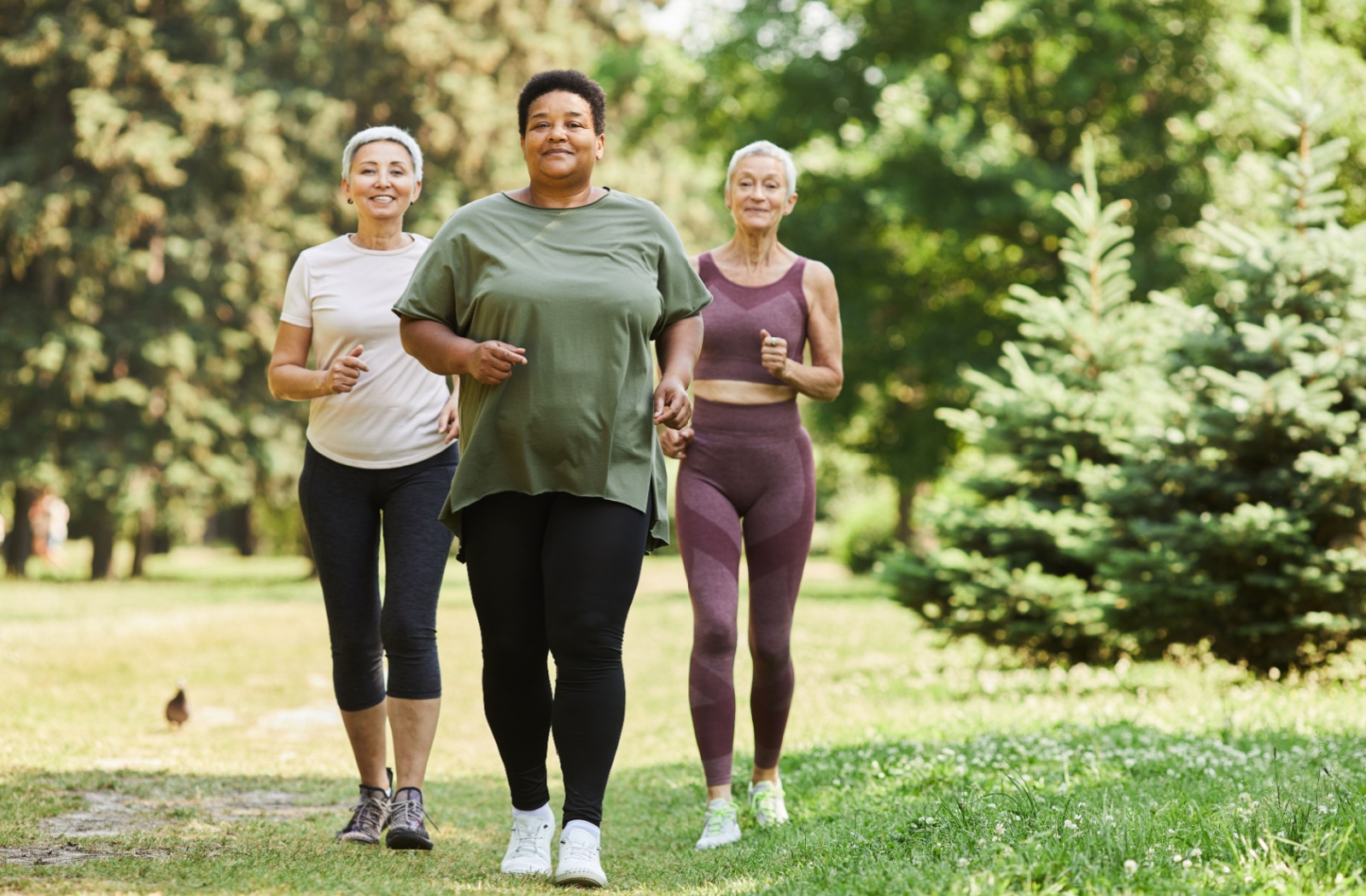 Three older women running.